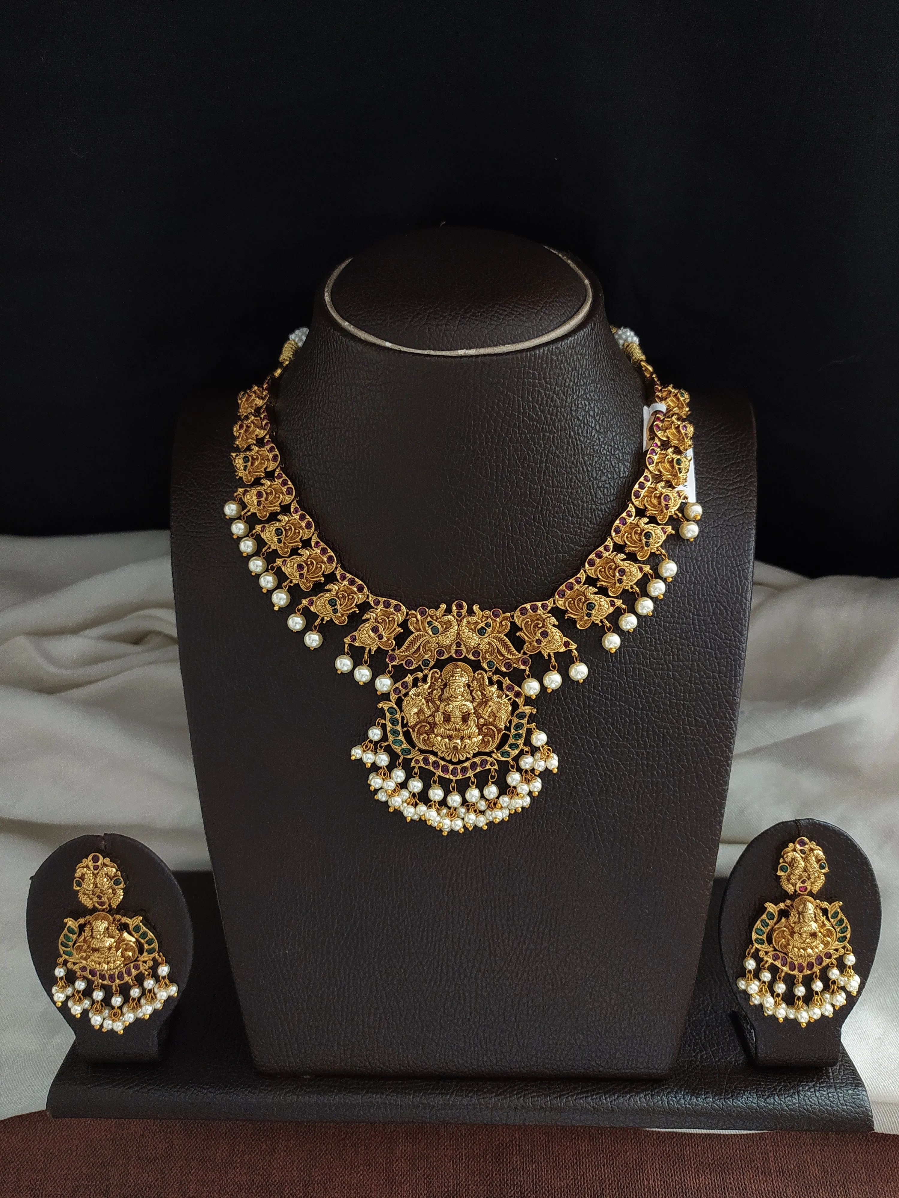 White Pearls Matt Finish Necklace Set With Peacocks and Lakshmi Design